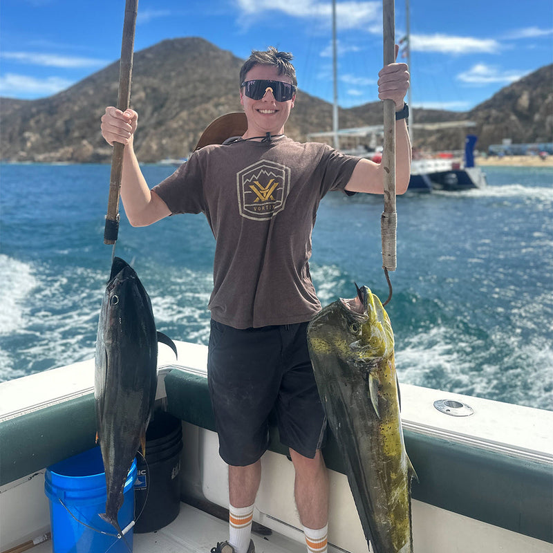 Narrow / Polarized Smoke | thats_why_i_took_all_these_photos.JPG | Boy holding two big fish wearing The Naples Original from Pit Viper Sunglasses