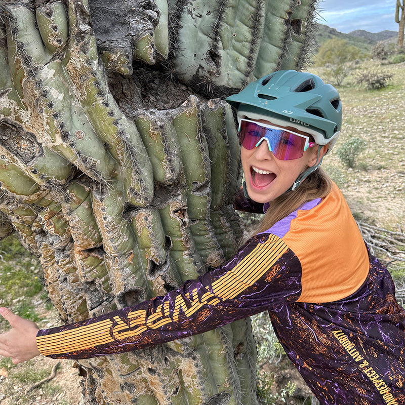 / Blue-Purple | he_said.JPG | Woman hugging a tree wearing The Bonaire Breeze Try-Hard from Pit Viper Sunglasses