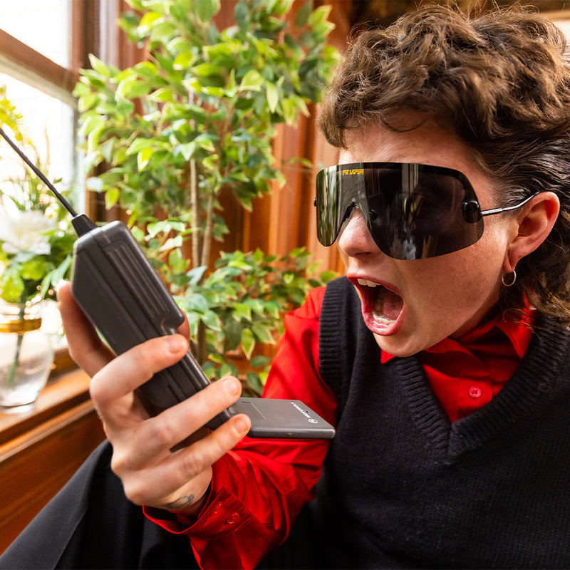 / Polarized Smoke | wow.JPG | Woman screaming at a phone wearing The Exec Limousine from Pit Viper Sunglasses