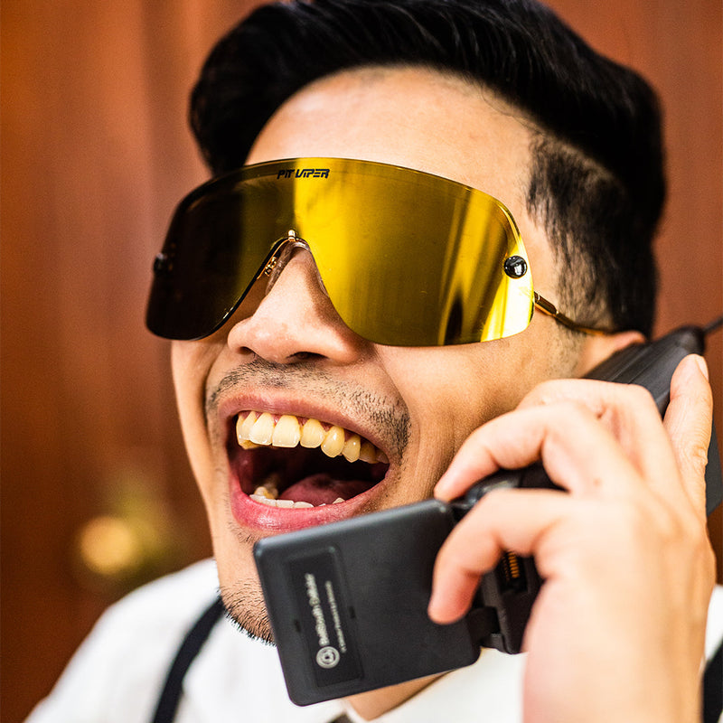 / Polarized Gold | ice_cream.JPG | Man on the phone wearing The Money Counter Limousine from Pit Viper Sunglasses
