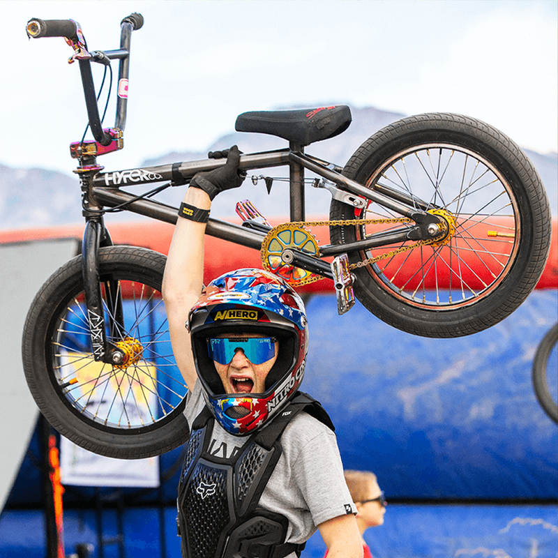 / Blue | organizing.JPG | Kid holding a BMX Bike wearing The Midnight XS from Pit Viper Sunglasses