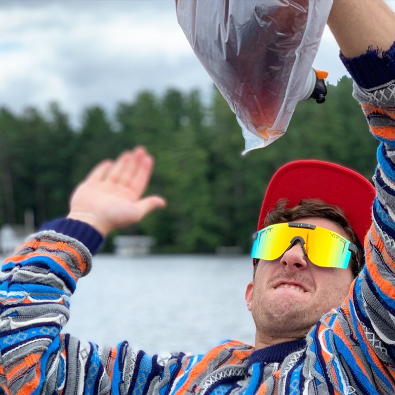 Wide / Polarized Orange | he_said.JPG | Man slapping a wine bag wearing The Monsterbull Original from Pit Viper Sunglasses