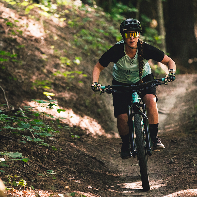 Narrow / Polarized Orange | the_last_image.JPG | Woman riding a mountain bike wearing The Monsterbull Original from Pit Viper Sunglasses