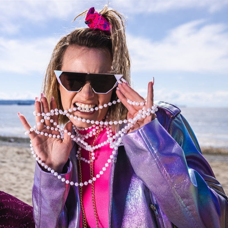 / Smoke | AHHH.JPG | Woman biting pearls wearing The Pearl Showroom from Pit Viper Sunglasses